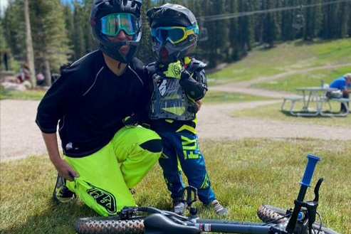 Kevin Jordan, of Snowmass Bike School, poses with young mountain biker.