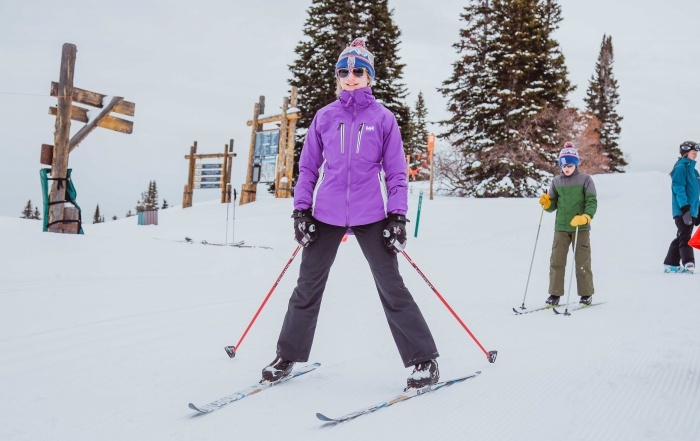 Two kids cross country ski