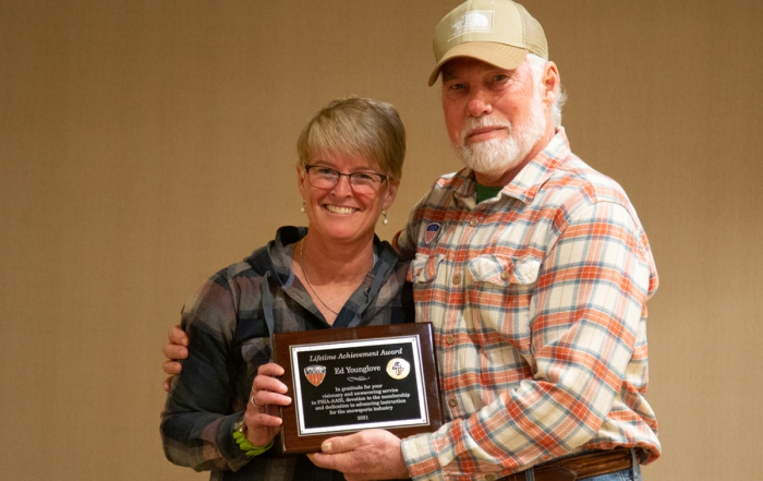 Ed Younglove receives the Lifetime Achievement Award from Eliza Kuntz