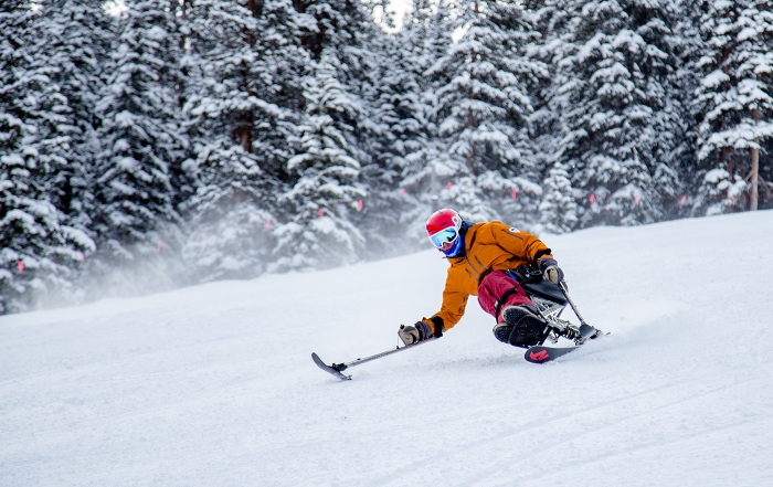 Adaptive team coach Geoff Krill mono-skis