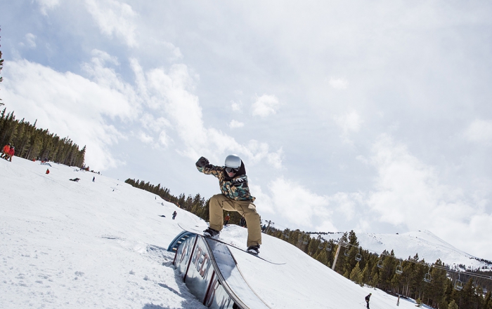 Matt Larson snowboards a rail at the Breckenridge park