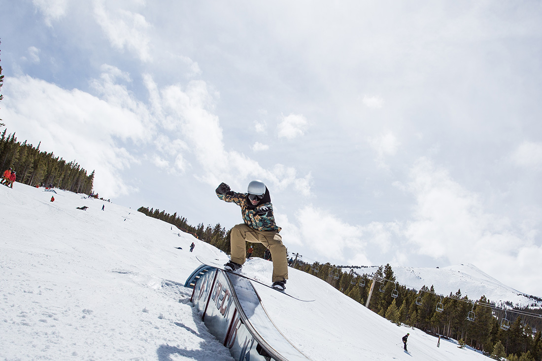 Matt Larson snowboards a rail at the Breckenridge park