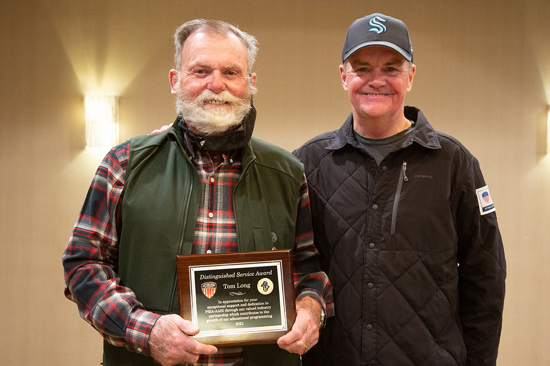 Robin May presents Tom Long the Distinguished Service Award.