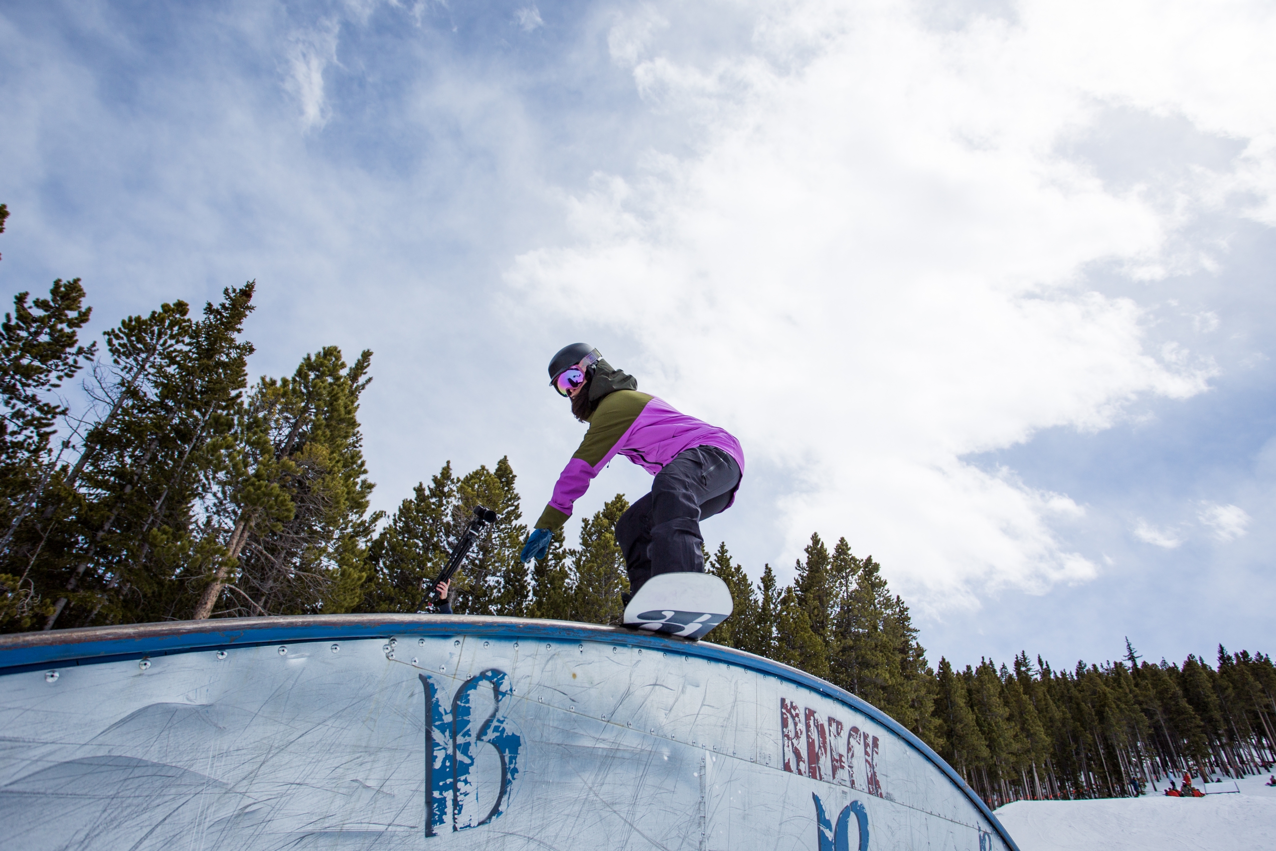 Christina Bruno snowboards a rainbow rail
