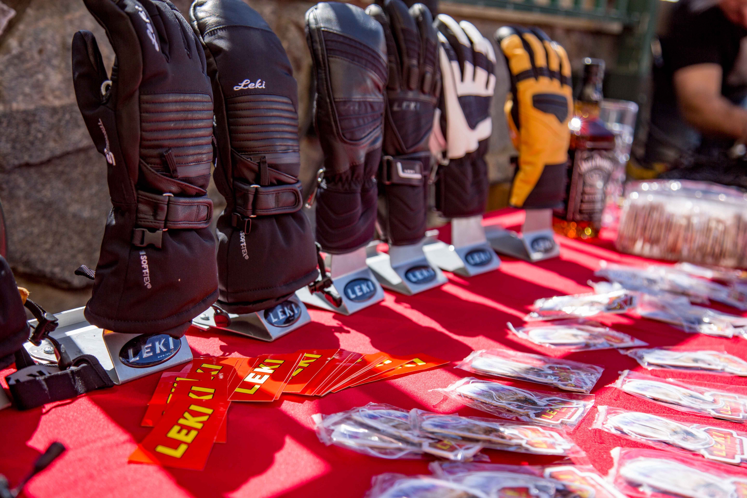 Leki gloves on a display table with stickers