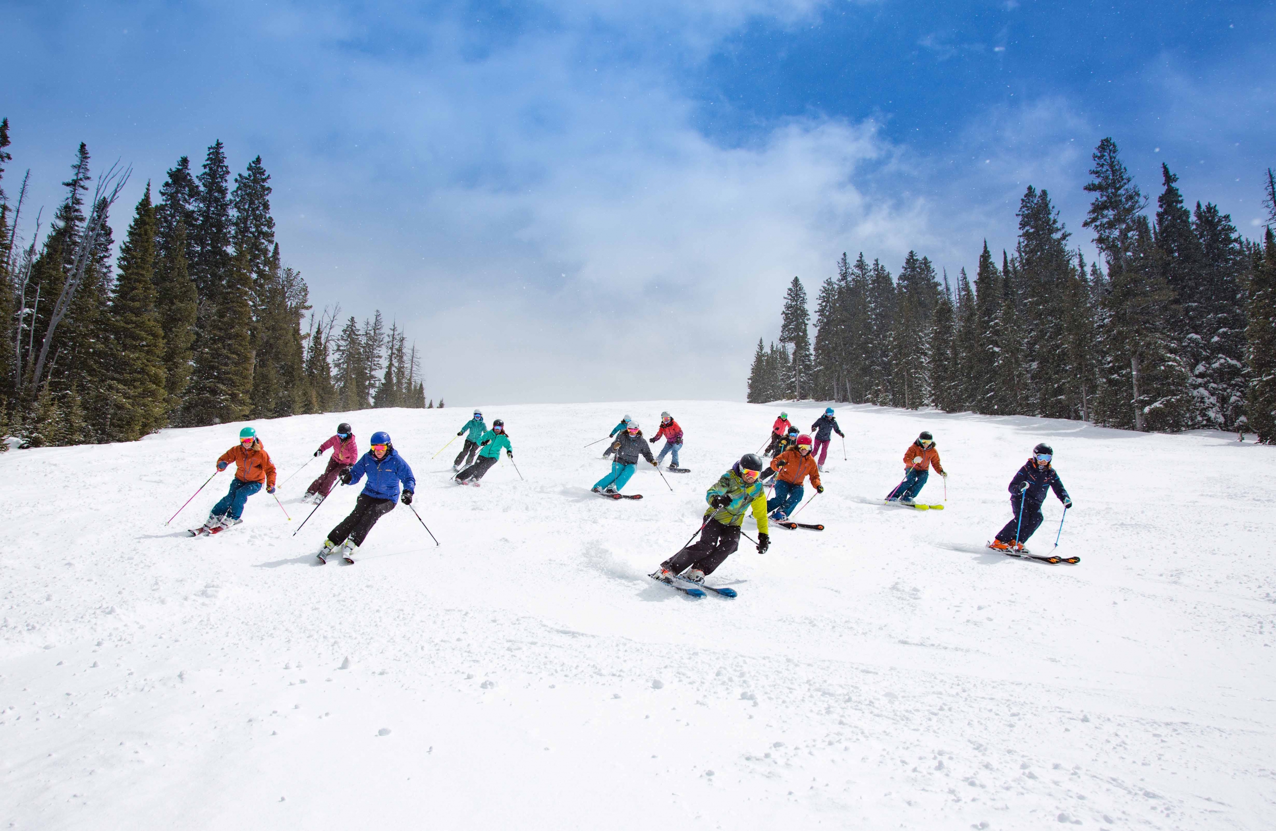 The Nancy Oakes Hall Women's Scholarship Committee skis and snowboards with scholarship recipients