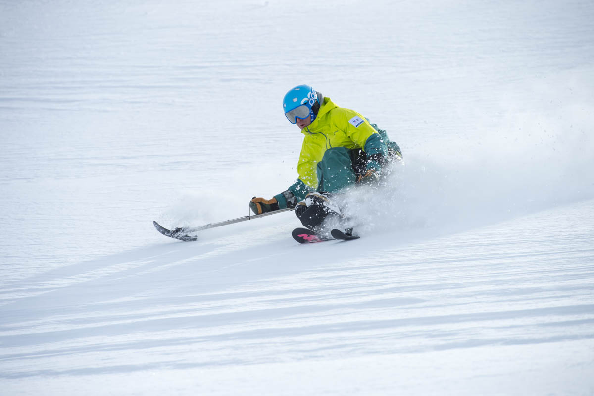 PSIA-AASI Adaptive Team Coach Geoff Krill demonstrates high-performance mono-skiing.