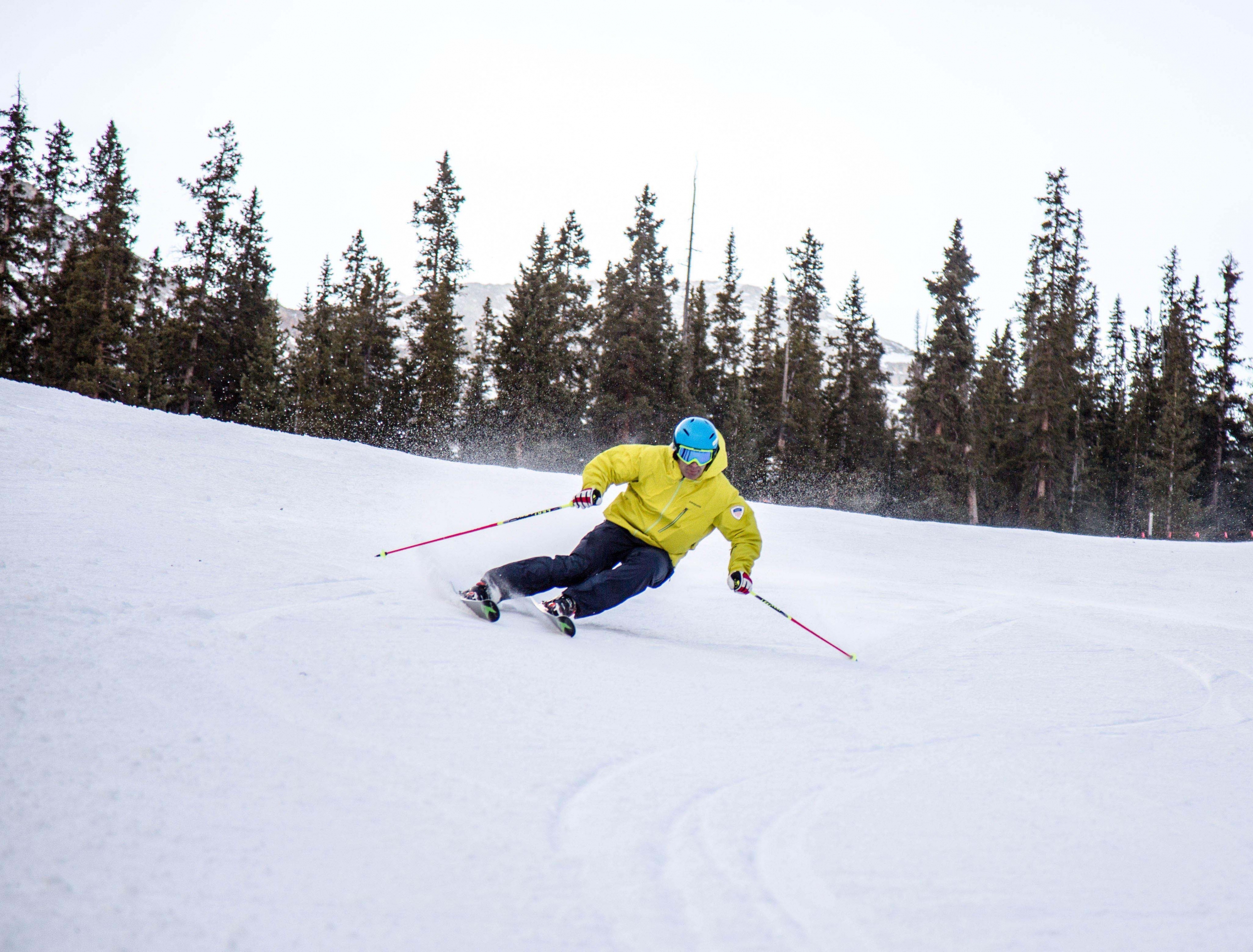 PSIA-AASI Alpine Team Coach Michael Rogan carves down a ski run