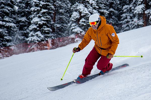 Telemark skier going down a hill.