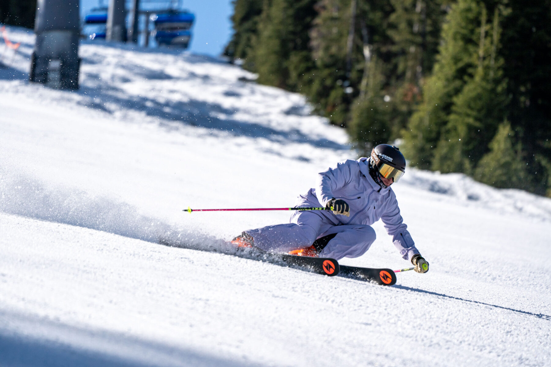 Male skier carving snow.