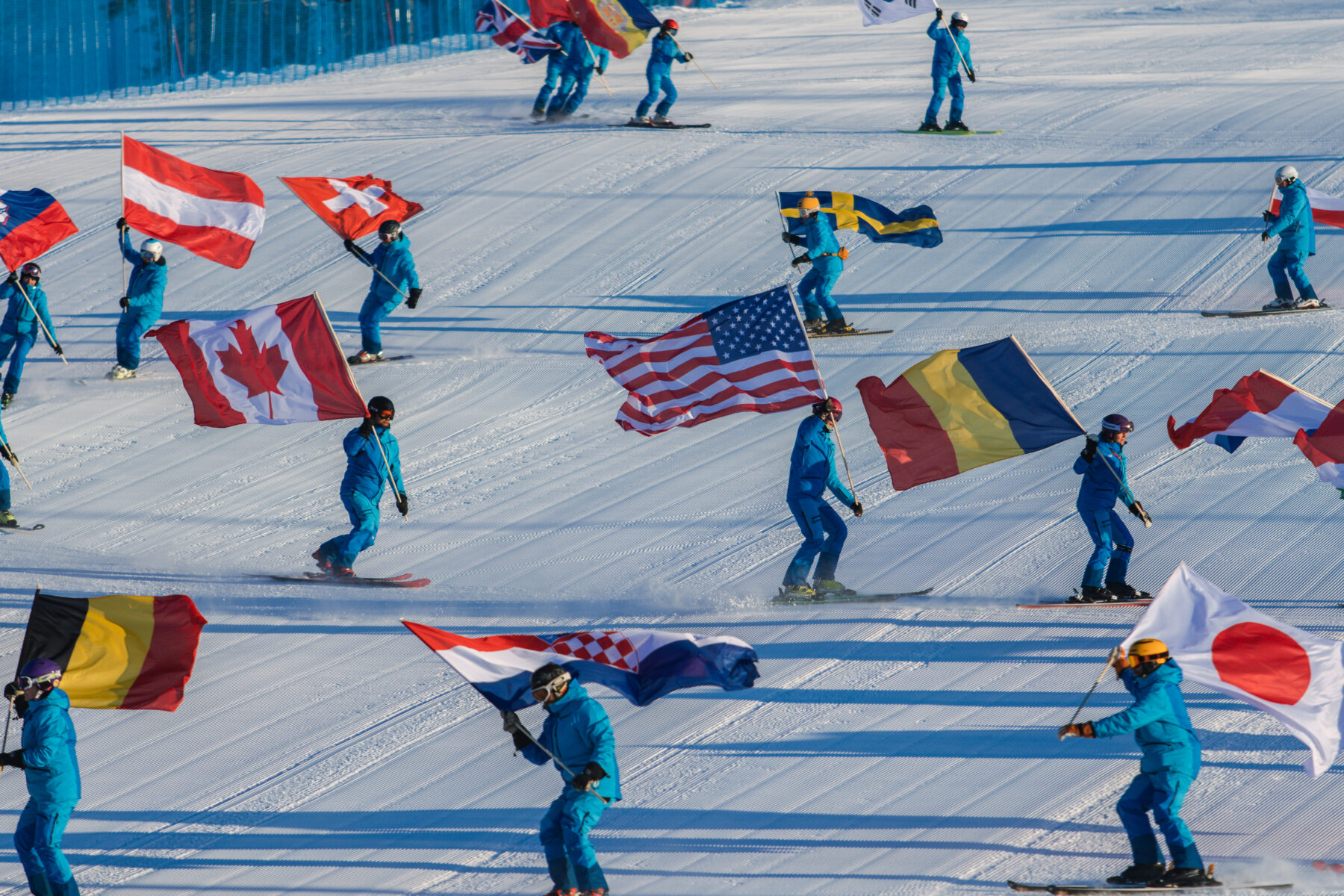 Interski event skiing with national flags