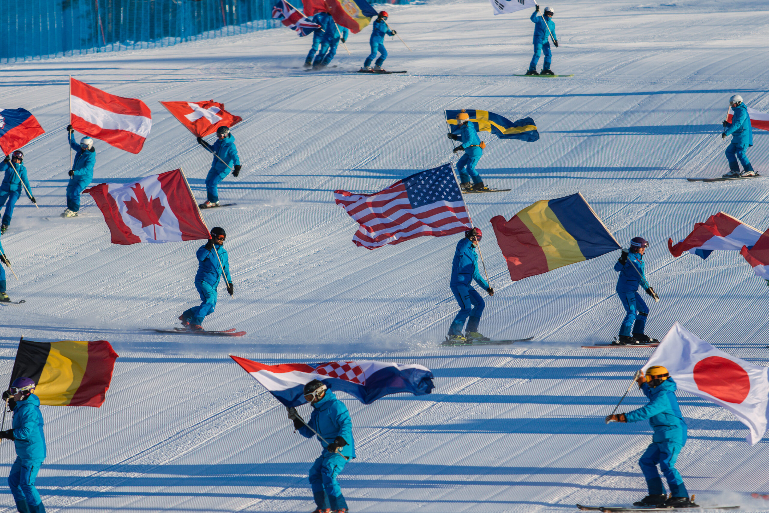Interski event skiing with national flags
