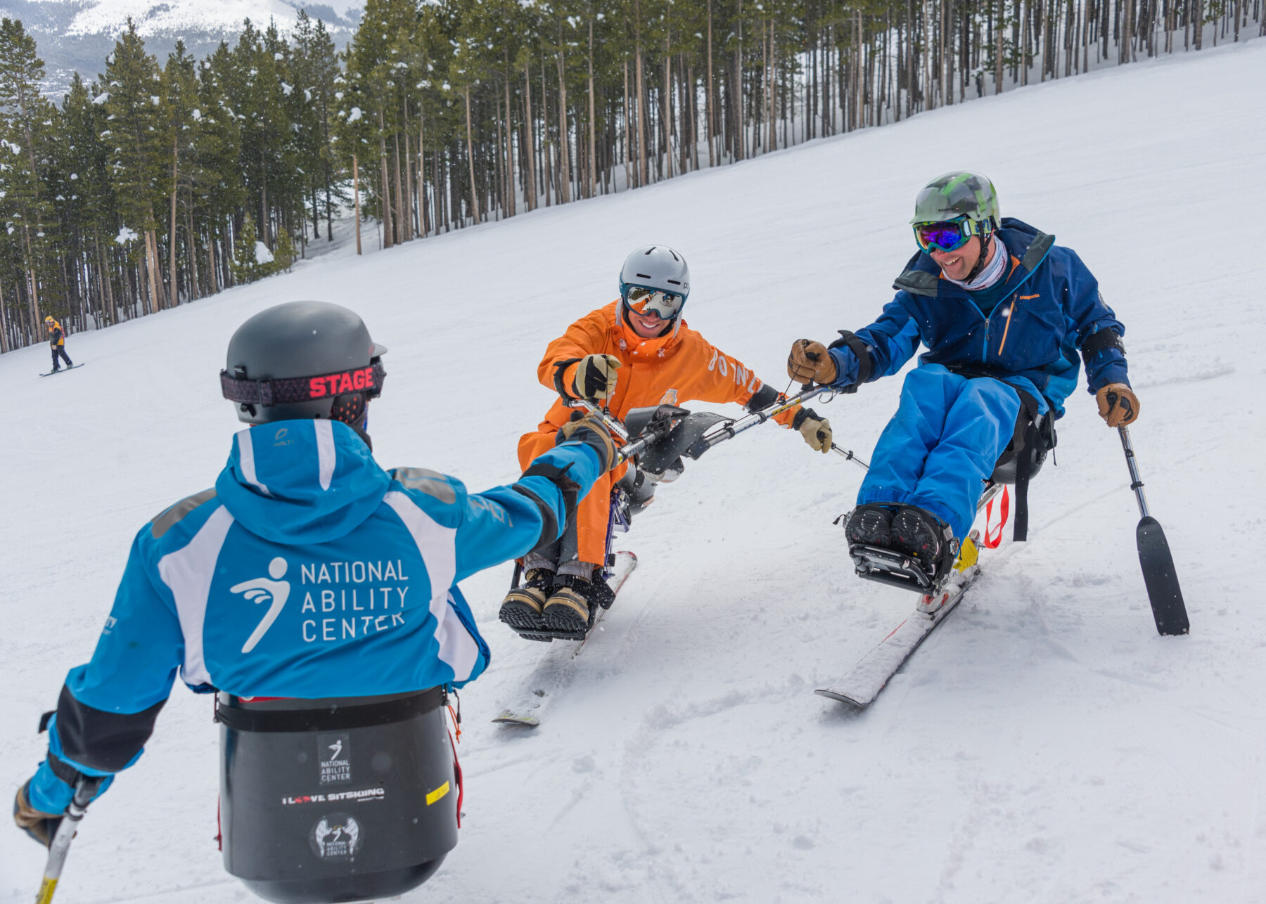 Adaptive sit skiers.