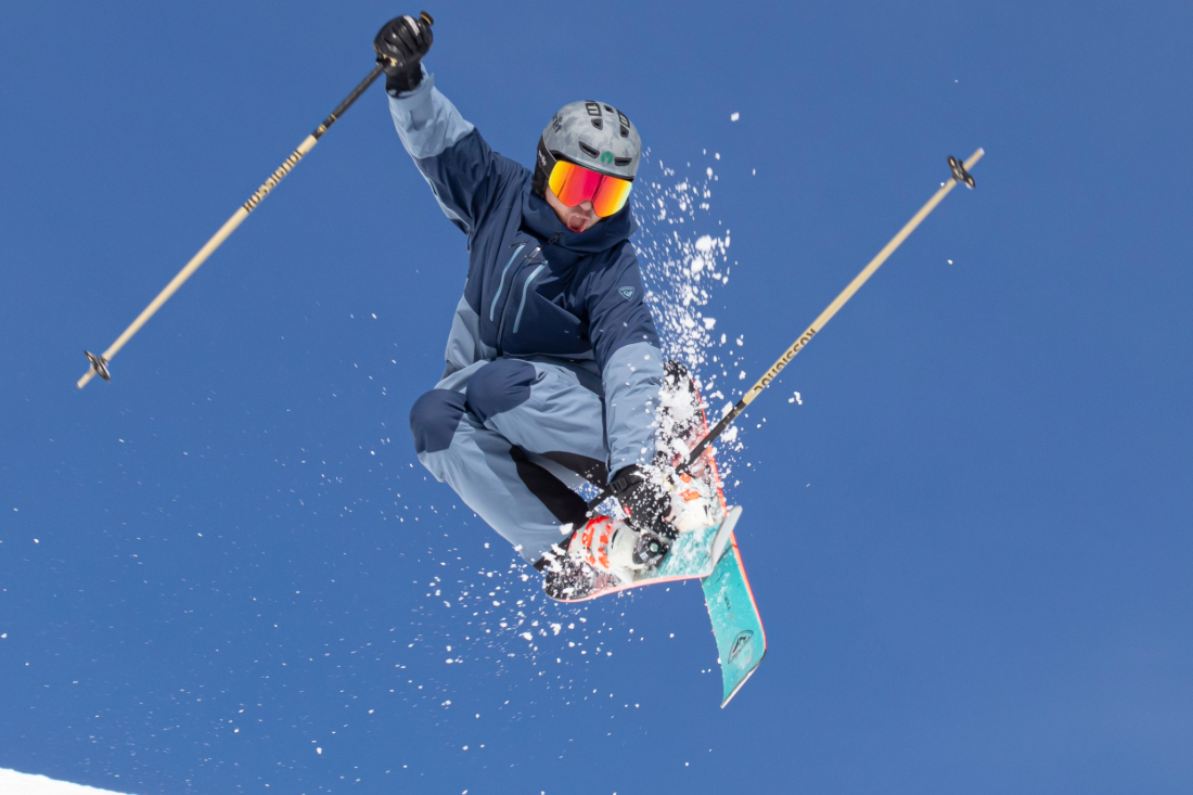 Skier in the air wearing a Pret helmet.